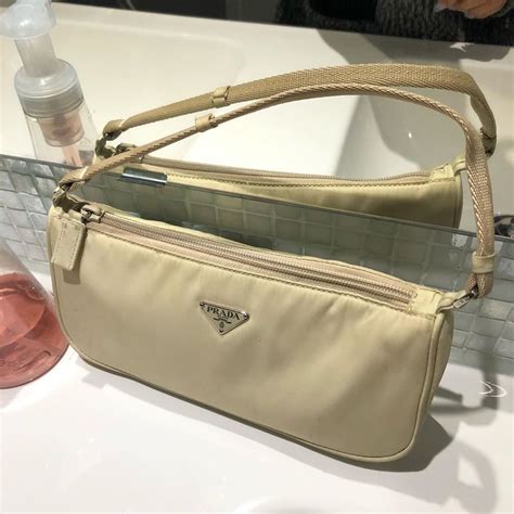 cream Prada bag